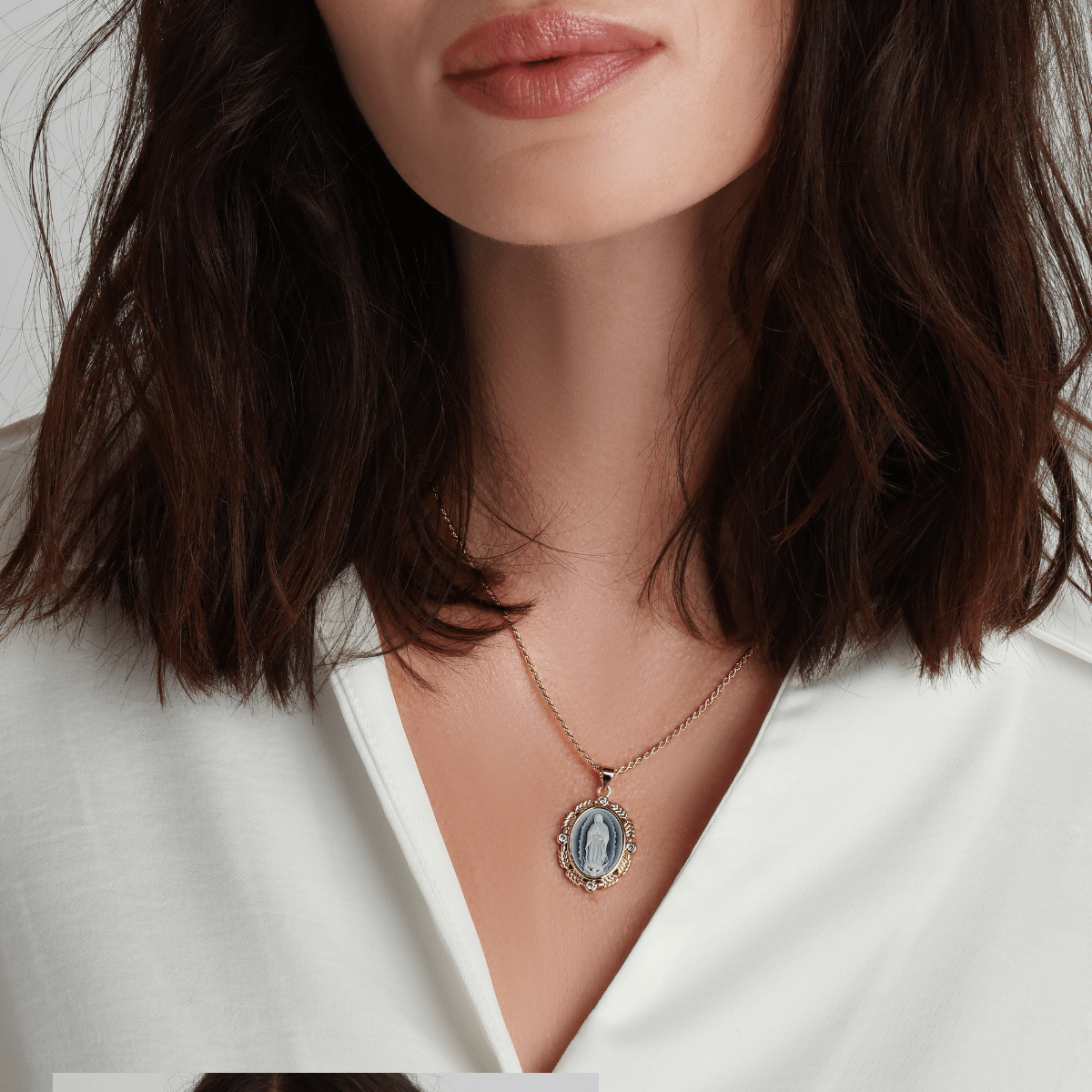 French Blue Cameo Mary necklace styled with layered gold jewelry