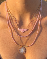 Solara Thunderbird Necklace in pink conch on a gold-filled chain