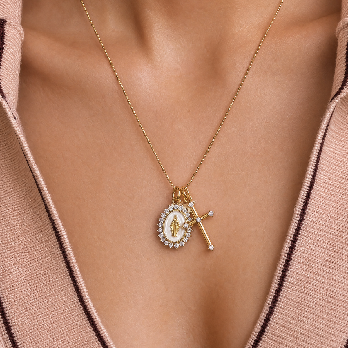 White Virgin Maria multi-charm faith necklace styled with gold jewelry