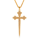 Athena Cross Necklace in Champagne CZ, a long gold cross with clover-shaped ends set with champagne cubic zirconia, on a gold chain
