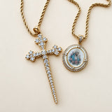 Athena Cross Necklace in White CZ, a gold cross set with white cubic zirconia on a rope chain, shown with the Marie Rose Necklace in White